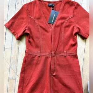 Rusty Denim Romper. New with tags by PrettyLittle Thing.
